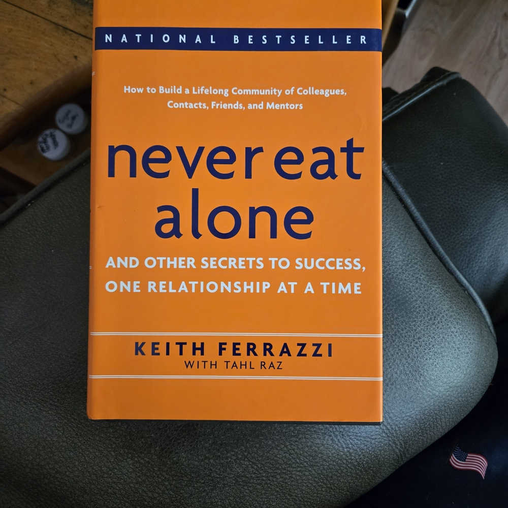Never Eat Alone by Keith Ferrazzi - Orange Cover